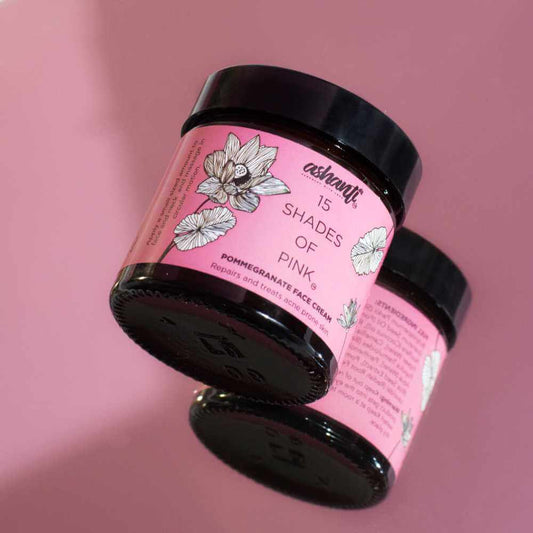 15 Shades of Pink Pomegranate Face Cream jars on a pink background, showcasing vegan skincare for hydration and nourishment.